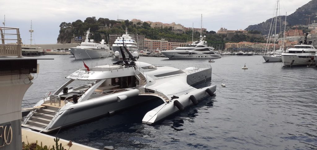 A boat is docked next to a body of water